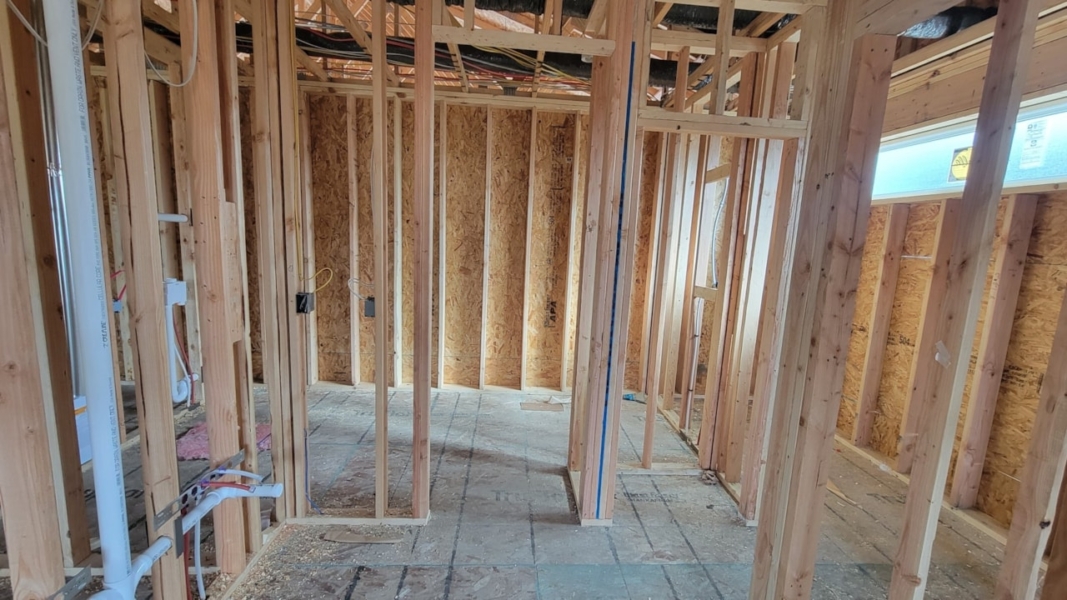 Bathroom featuring wood framing and a tub, part of Happe Homes available homes at 2912 NW Beechwood Ct, Ankeny, IA.