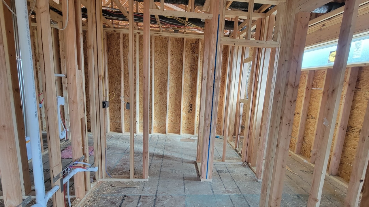 Bathroom featuring wood framing and a tub, part of Happe Homes available homes at 2912 NW Beechwood Ct, Ankeny, IA.