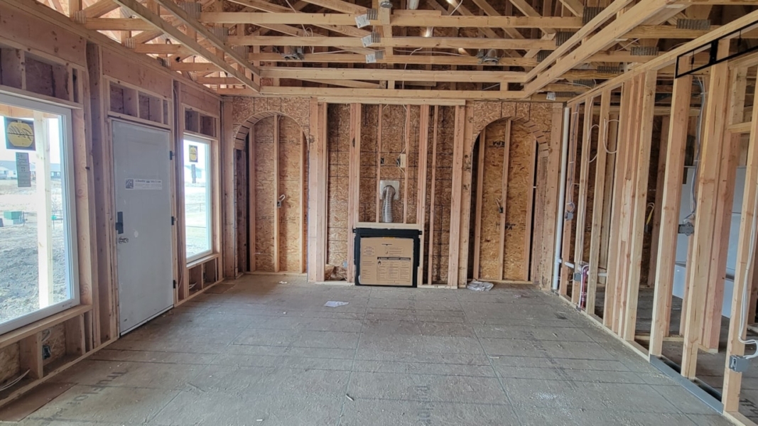 Cozy room featuring wood framing and a fireplace, showcasing Happe Homes' available properties in Ankeny, IA