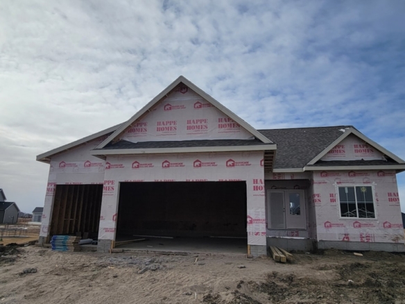New house under construction with garage and siding, available for sale by Happe Homes at 2912 NW Beechwood Ct, Ankeny, IA.