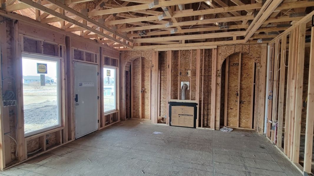 Room with wood framing and a door, showcasing Happe Homes' available move-in ready homes in Ankeny, IA.