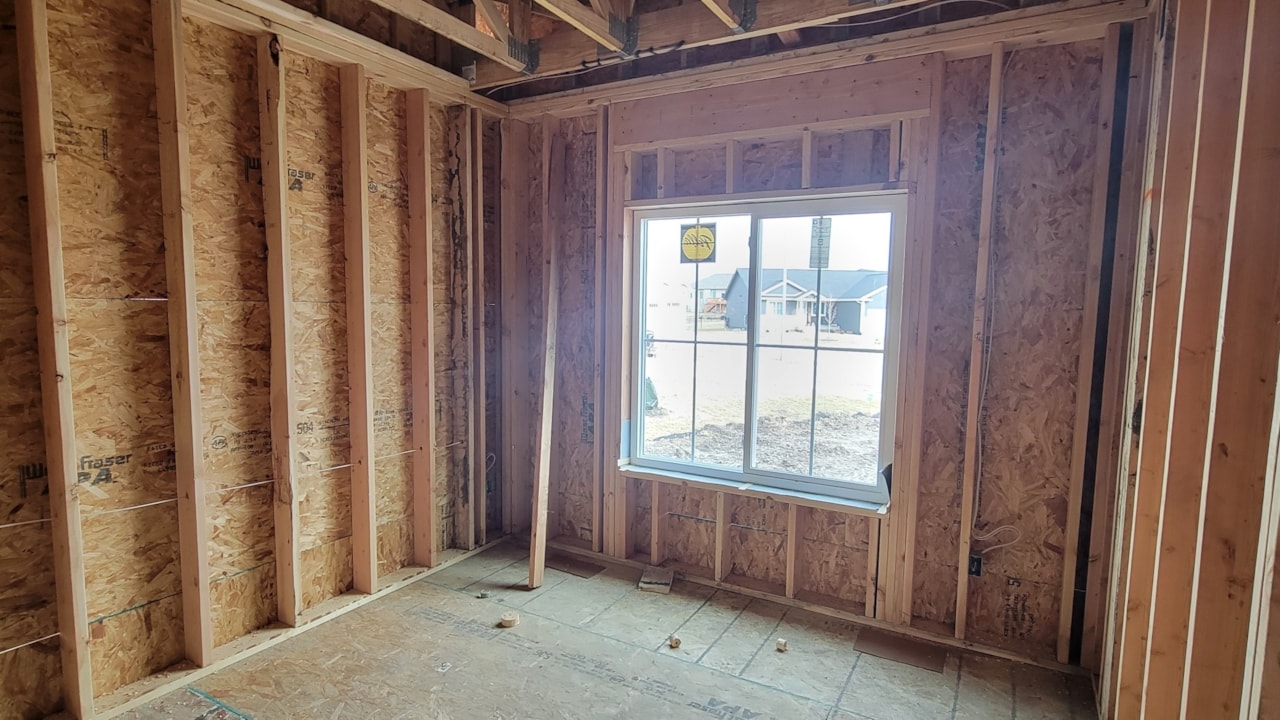 Room with wood framing and windows, showcasing Happe Homes' available move-in ready homes in Ankeny, IA.