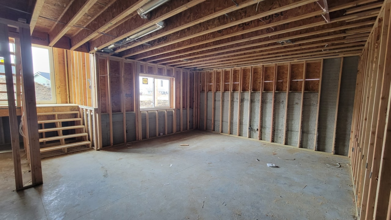 Unfinished room with wood framing, showcasing Happe Homes' new move-in ready homes at 2912 NW Beechwood Ct, Ankeny, IA